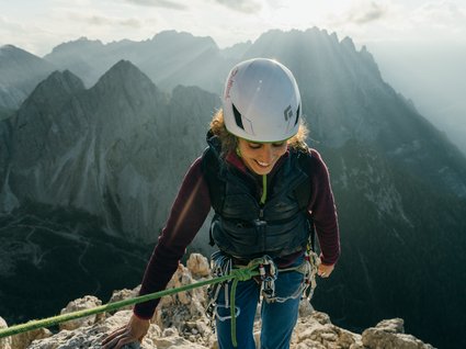 Holidays at the Brenner Pass: hiking and climbing Climber with helmet on mountain in sunlight